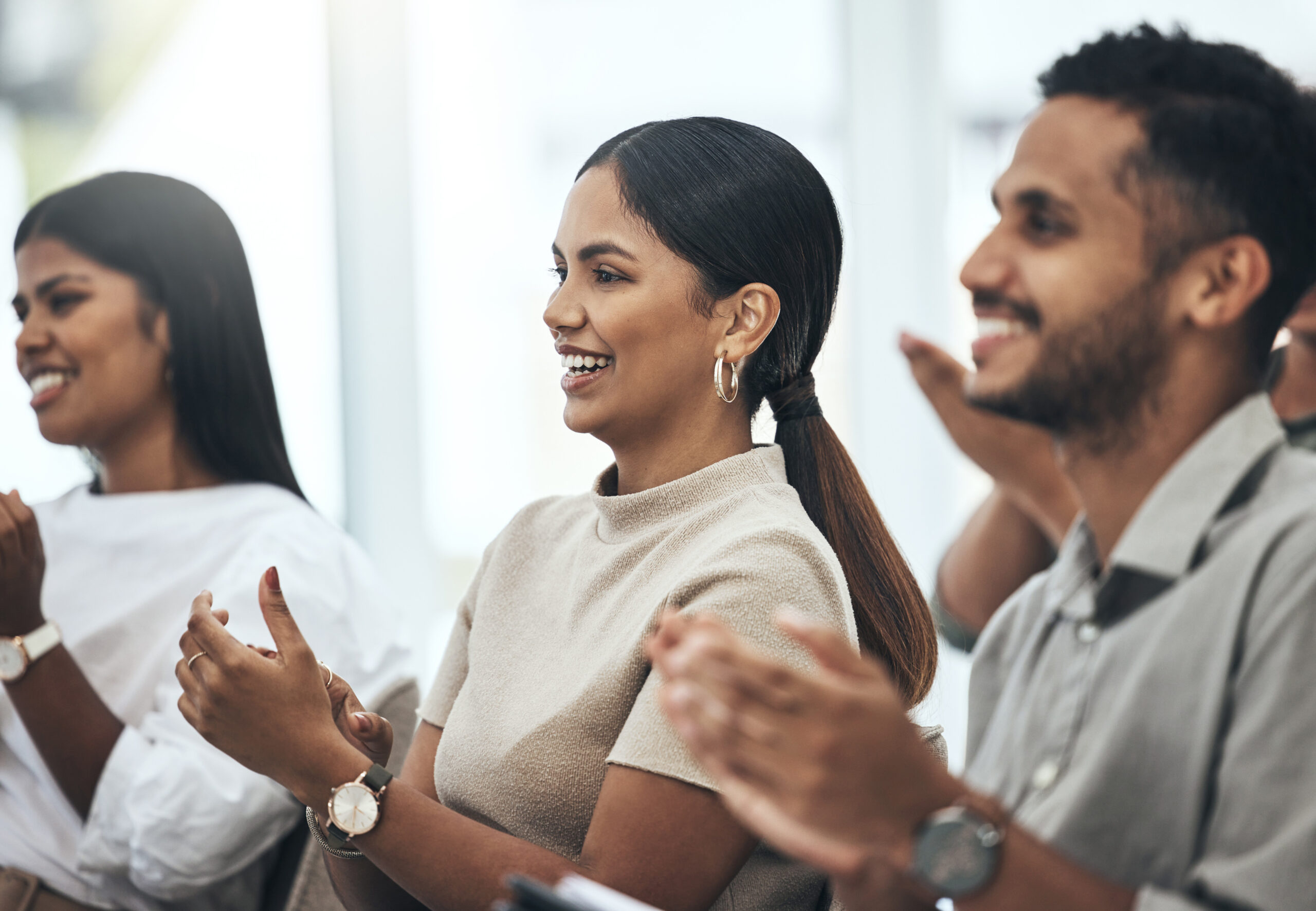 Success, conference and audience applause in a boardroom of their workplace.Team diversity, support or good news and colleagues group clap for achievement or celebration of meeting results in office.